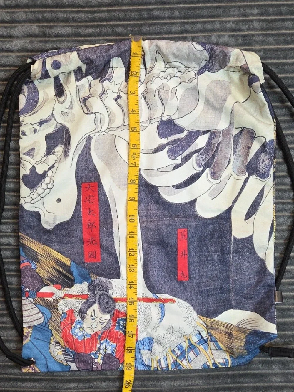 Skeleton Graphic Drawstring Backpack in Blue and White